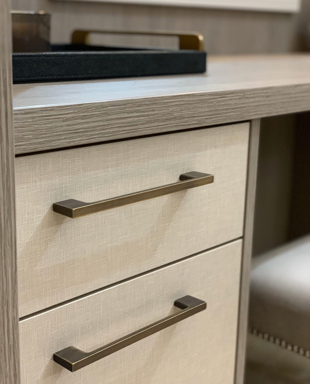 Image show detail of Langham drawers finished in Beige Silk with Brushed Bronze handles